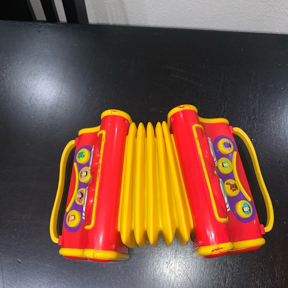 2004 Spin Master "The Wiggles" Musical Play Along Toy Accordion.